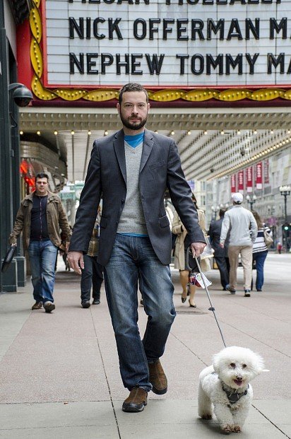 Bichon Frise walking with owner