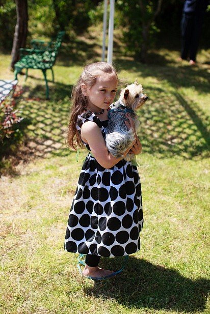 Child with a Yorkshire Terrier